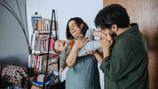 Couple holding their child