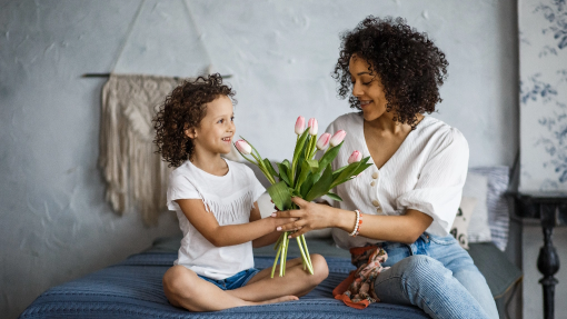 Mother and daughter with flowers