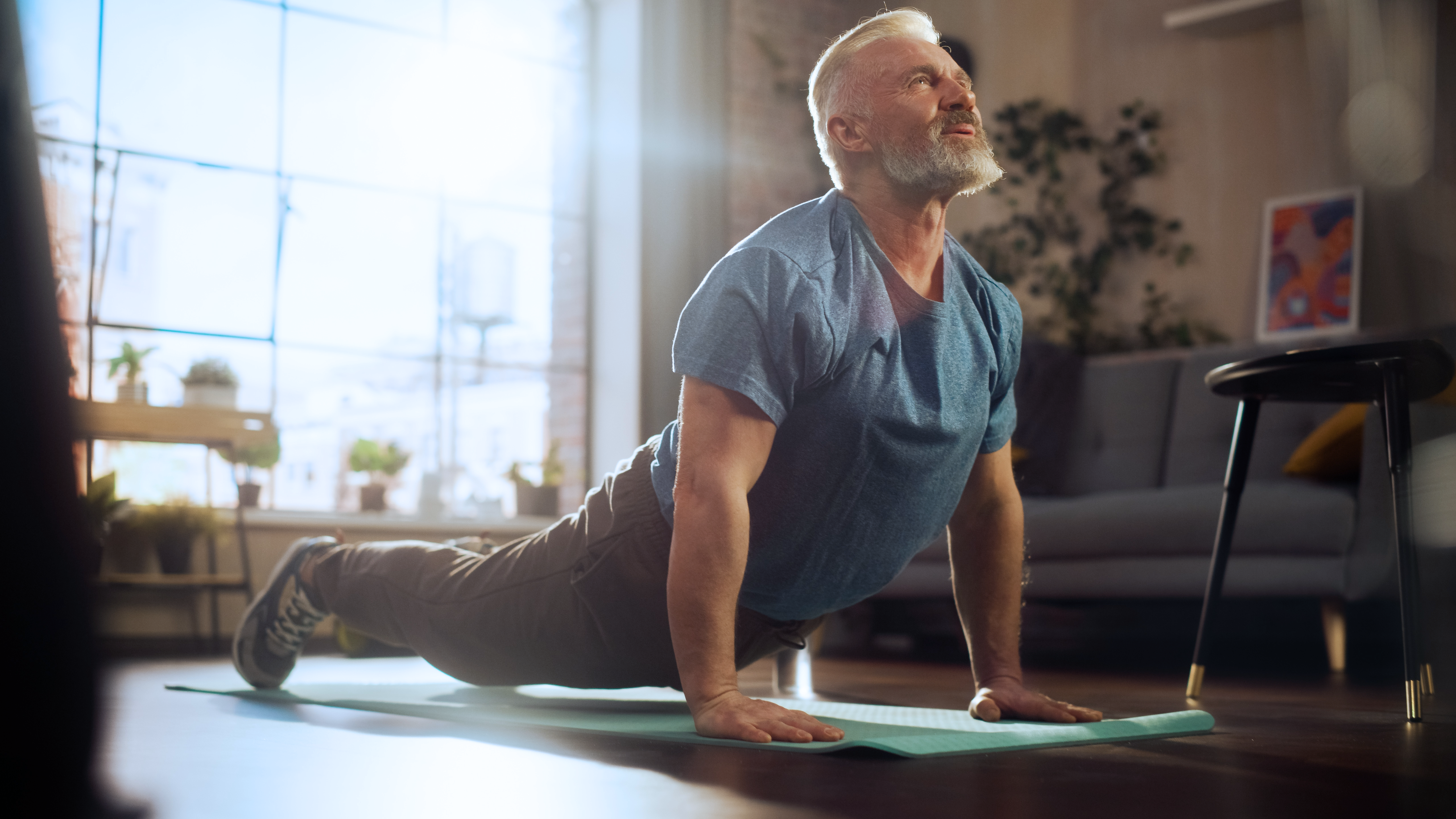 Man doing yoga at home